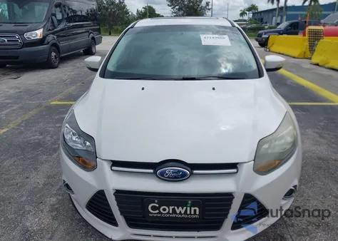 2013 Ford Focus Titanium z USA, uszkodzony, nr VIN 1FADP3J20DL123757